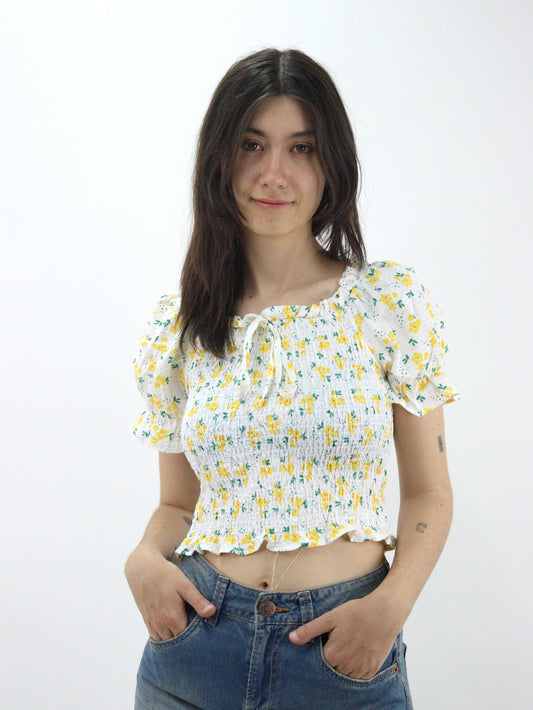 Blusa corta con estampado floral de manga farol con nudo delantero