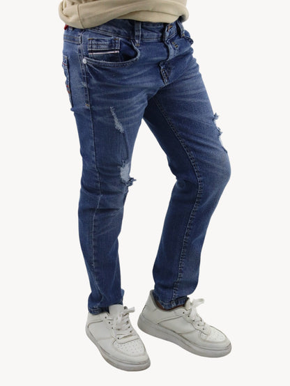 Jeans slim azul deslavado con destrucción