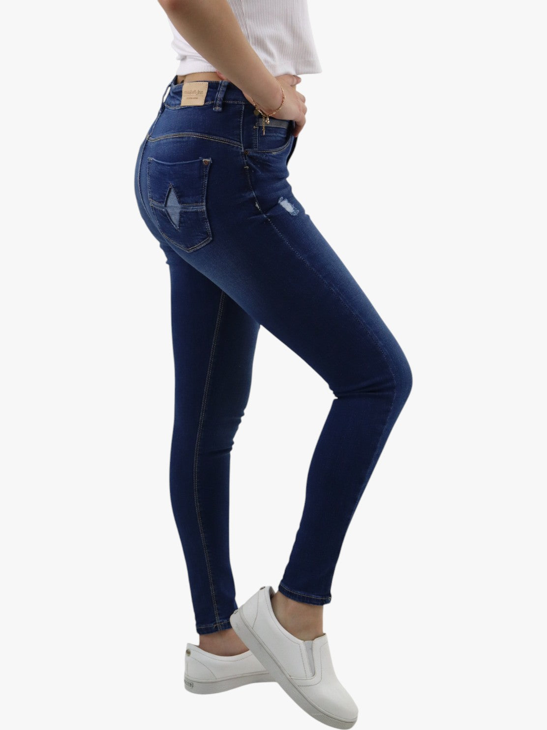 Jeans skinny tiro alto color azul oscuro con destrucción