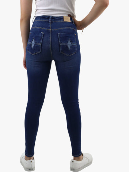 Jeans skinny tiro alto color azul oscuro con destrucción