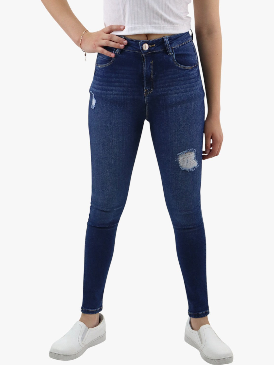 Jeans skinny tiro alto color azul oscuro con destrucción