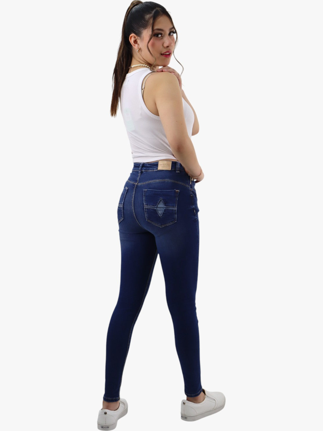 Jeans skinny tiro alto color azul oscuro con destrucción