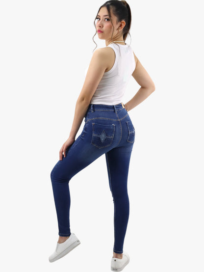 Jeans skinny tiro alto color azul oscuro con destrucción