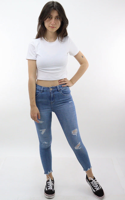 Jeans tobillero azul medio con destrucción