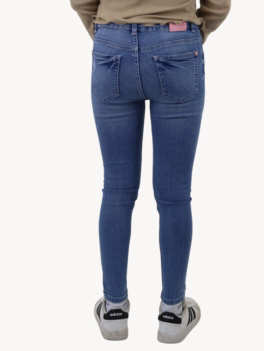 Jeans skinny con colgante decorativo