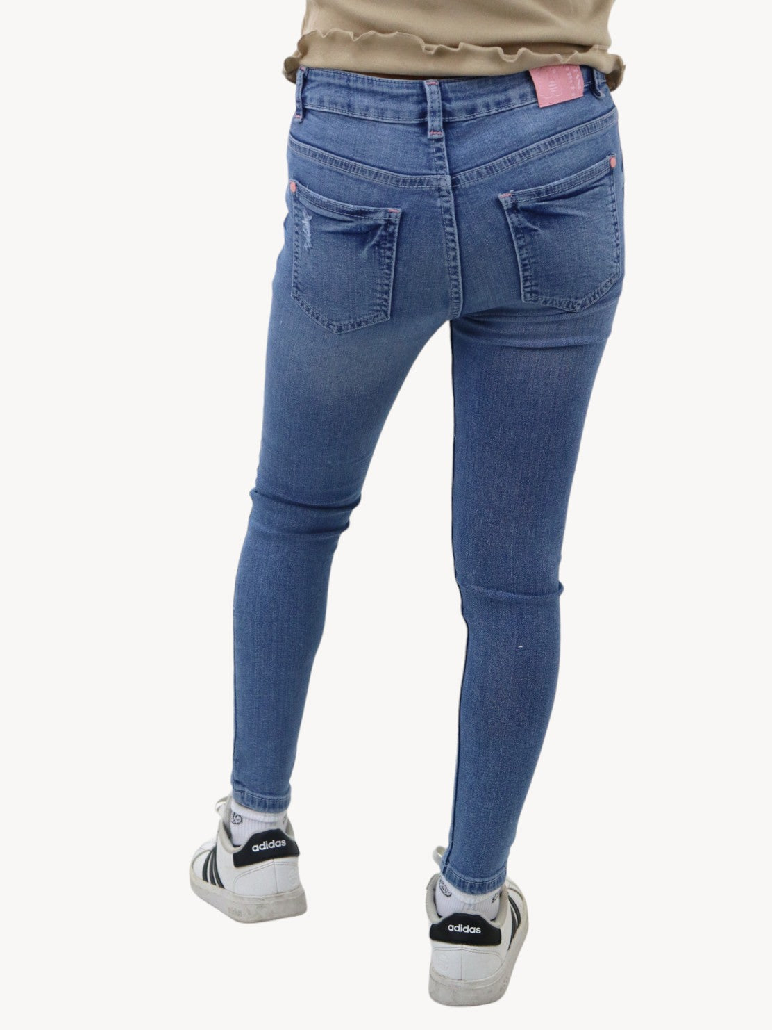 Jeans skinny con colgante decorativo