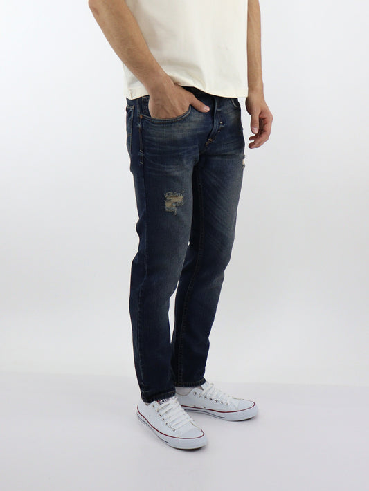 Jeans skinny azul con tinta